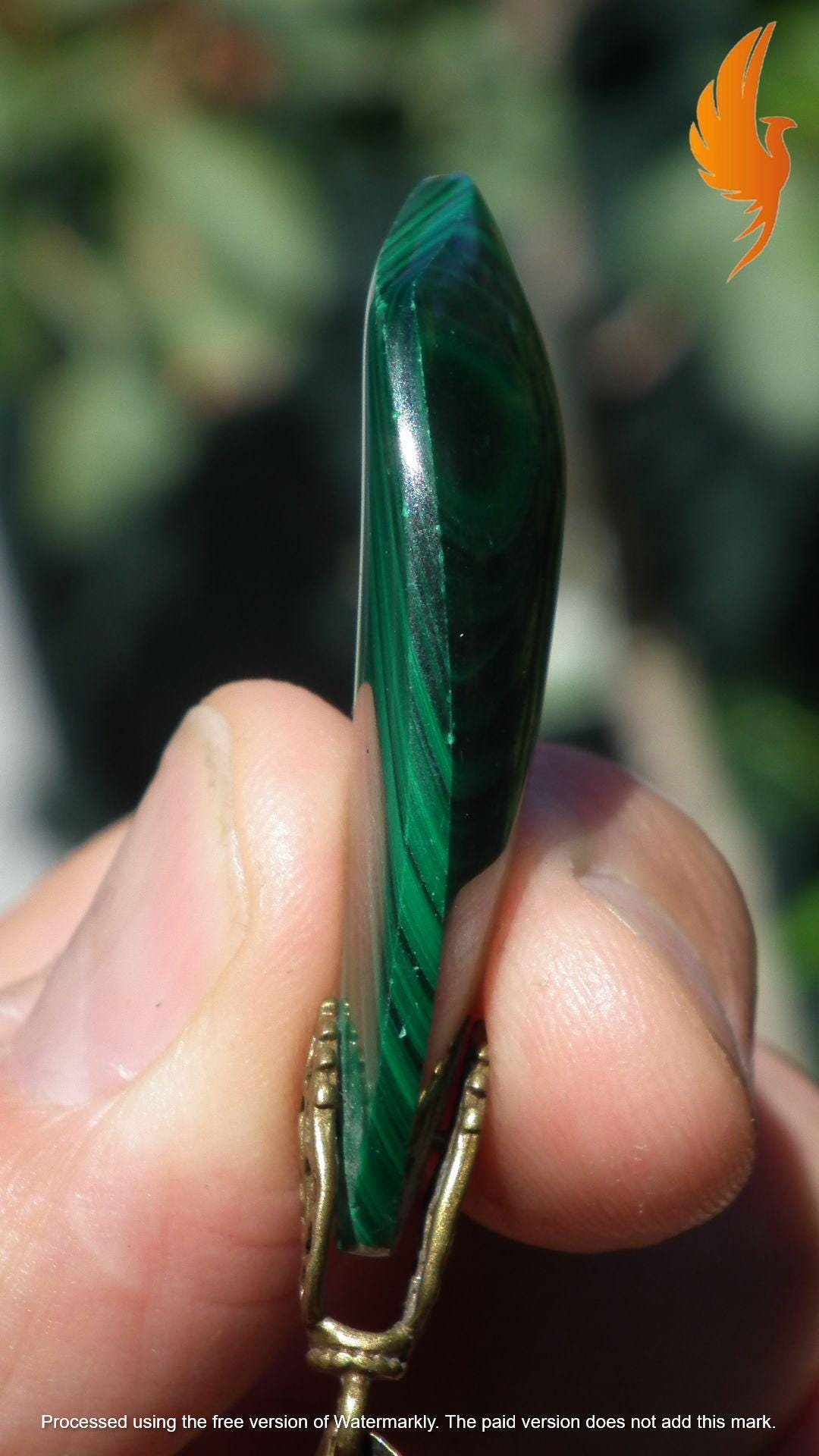 Malachite pendant with bronze bail