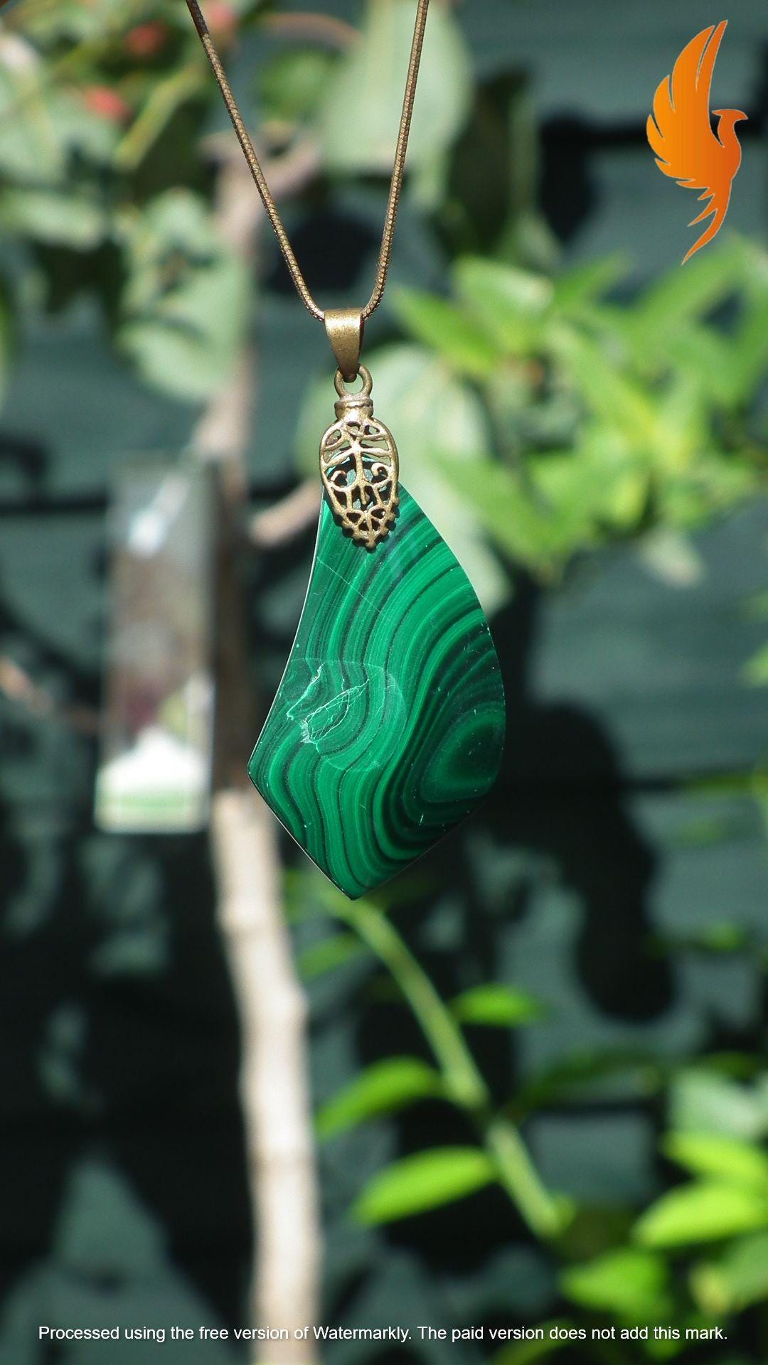 Malachite pendant with bronze bail