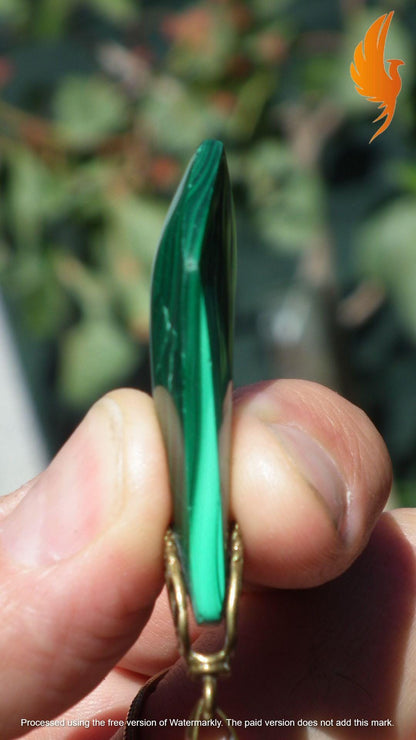 Malachite pendant with bronze bail