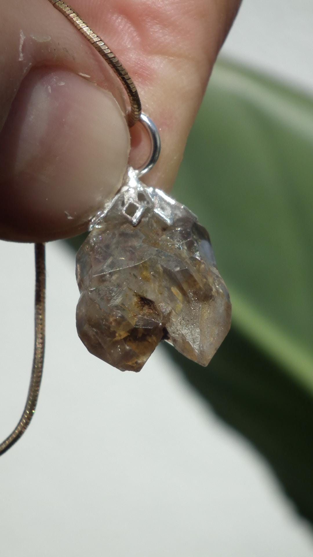 Uv reactive crystal pendant // Petroleum quartz // Terminated quartz