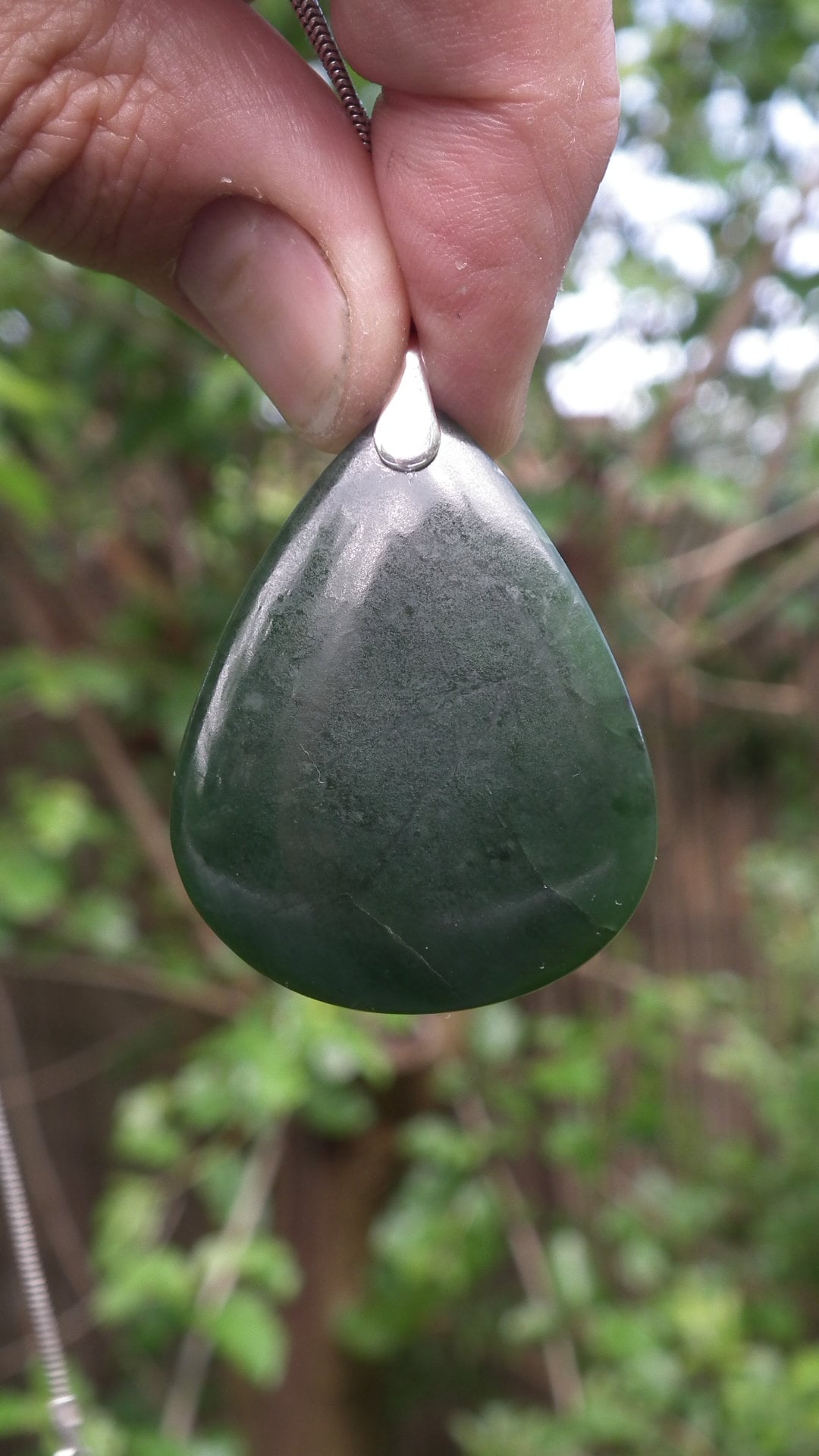 Nephrite jade pendant with sterling silver bail