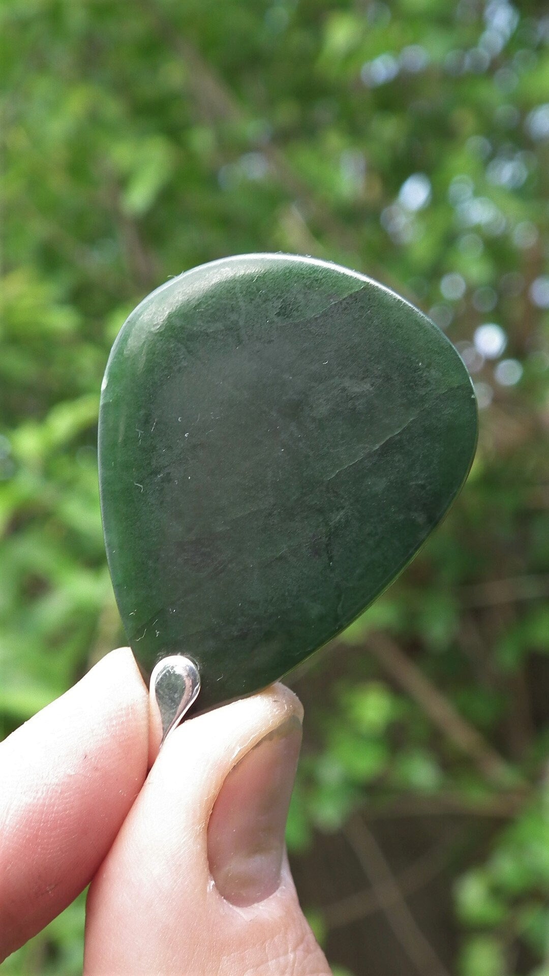Nephrite jade pendant with sterling silver bail