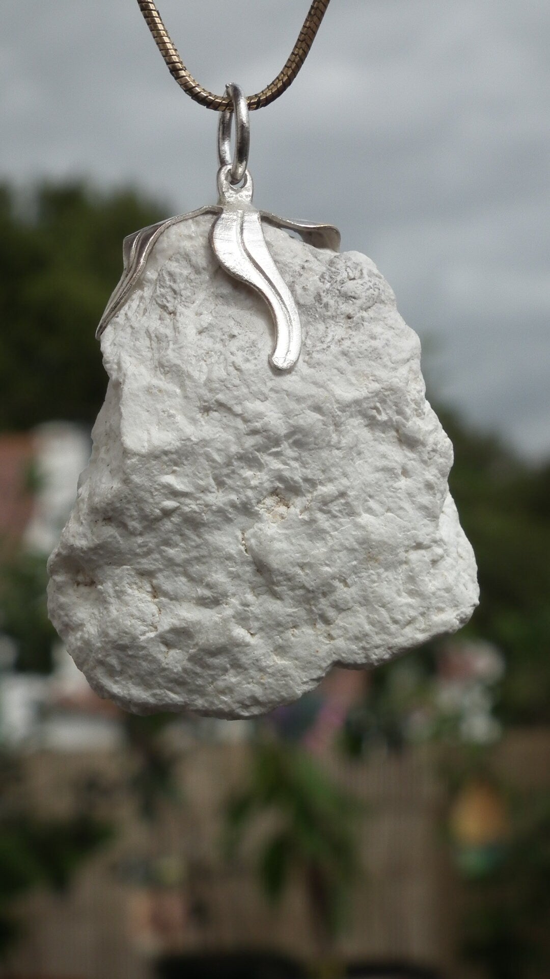 Natural rough magnesite pendant with silverplated bail