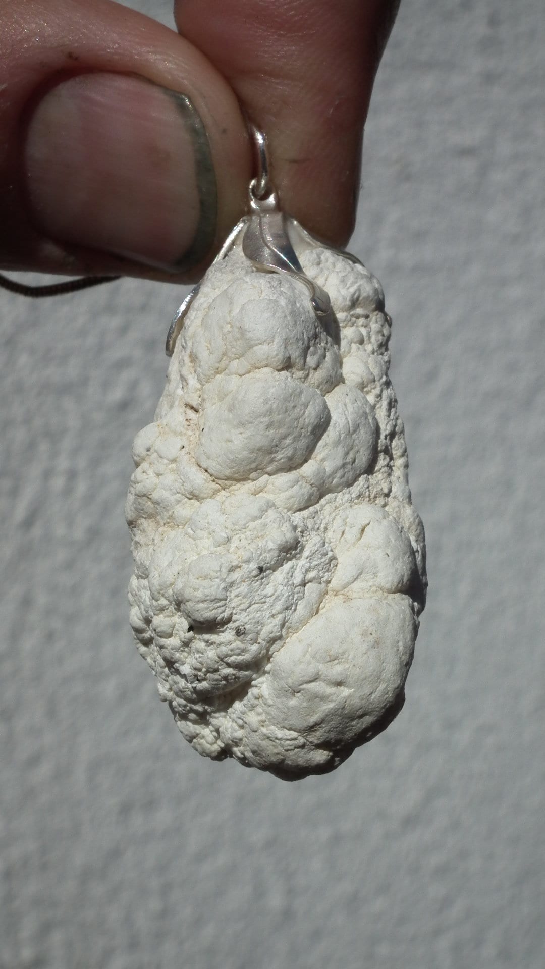 Natural rough magnesite pendant with silverplated bail