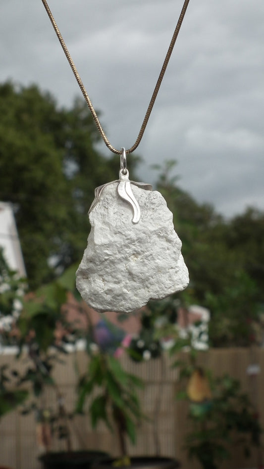 Natural rough magnesite pendant with silverplated bail